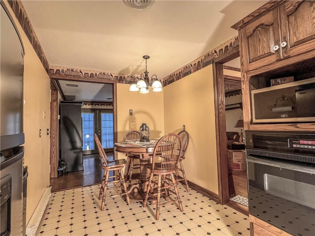 138 Rhoer Road Slippery Rock, PA 16057 - Photo 11 of 23 a dining room with furniture and a kitchen view