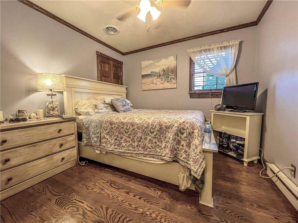 138 Rhoer Road Slippery Rock, PA 16057 - Photo 15 of 23 a bedroom with a bed and wooden floor