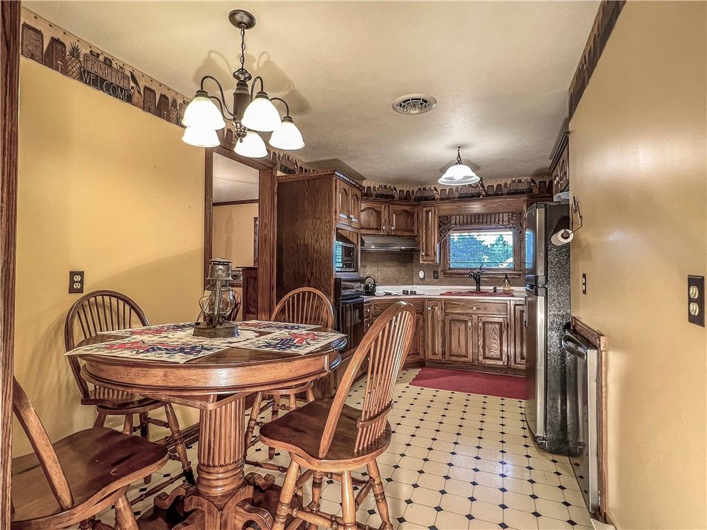 138 Rhoer Road Slippery Rock, PA 16057 - Photo 8 of 23 a view of a dining room with furniture and chandelier