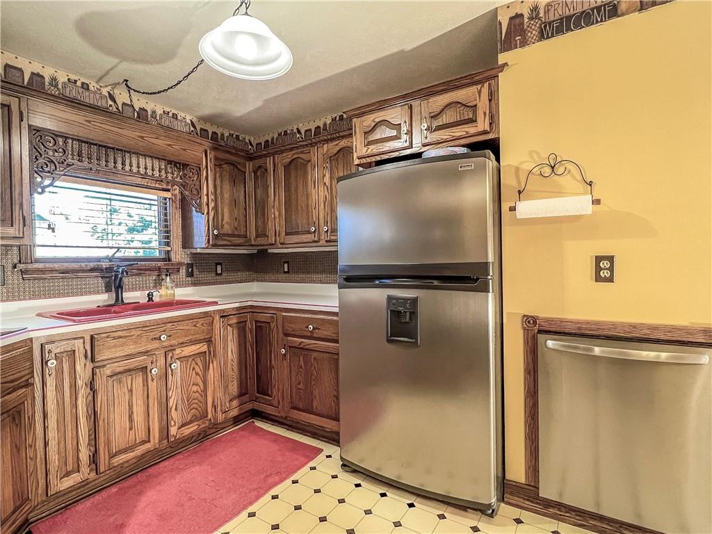 138 Rhoer Road Slippery Rock, PA 16057 - Photo 10 of 23 a kitchen with granite countertop a sink stainless steel appliances and cabinets