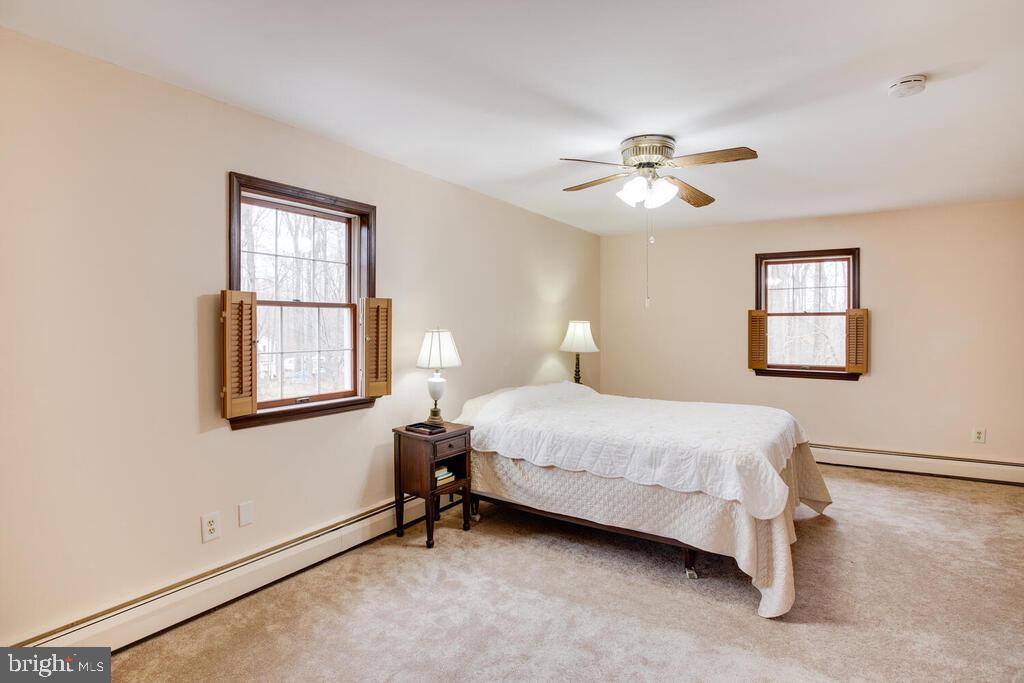 936 Grace Road Huntingtown, MD 20639 - Photo 29 of 64 a bedroom with a bed and a window