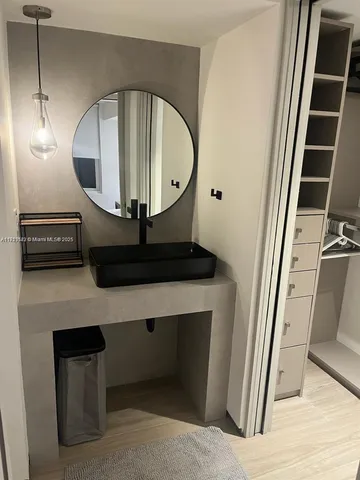 a living room with a mirror and a table