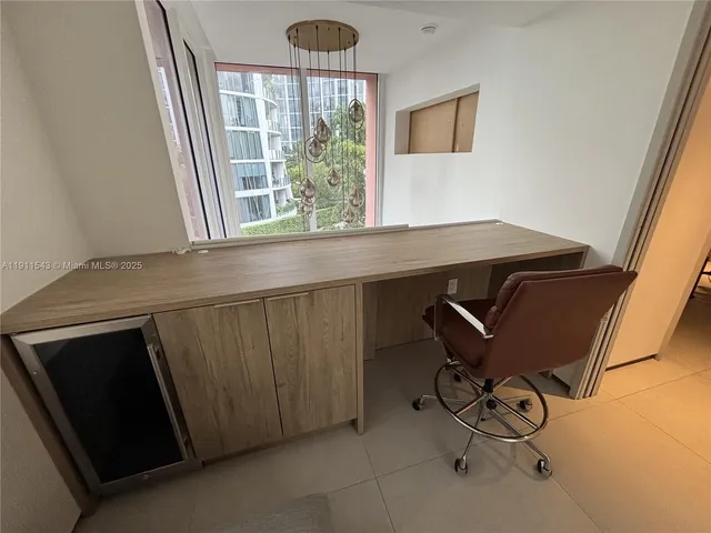 a view of a livingroom with furniture and windows