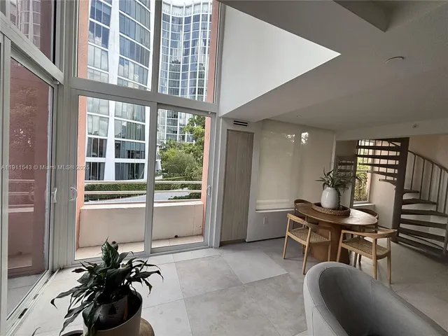 a room with furniture and a large window