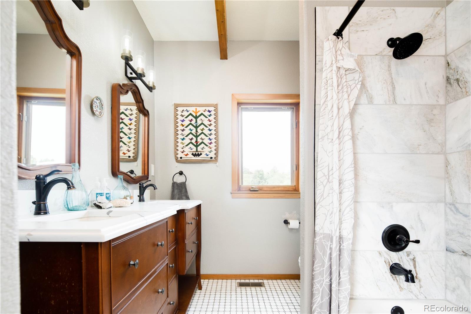 729 Coronado Drive Sedalia, CO 80135 - Photo 16 of 28 a bathroom with a double vanity sink mirror and shower