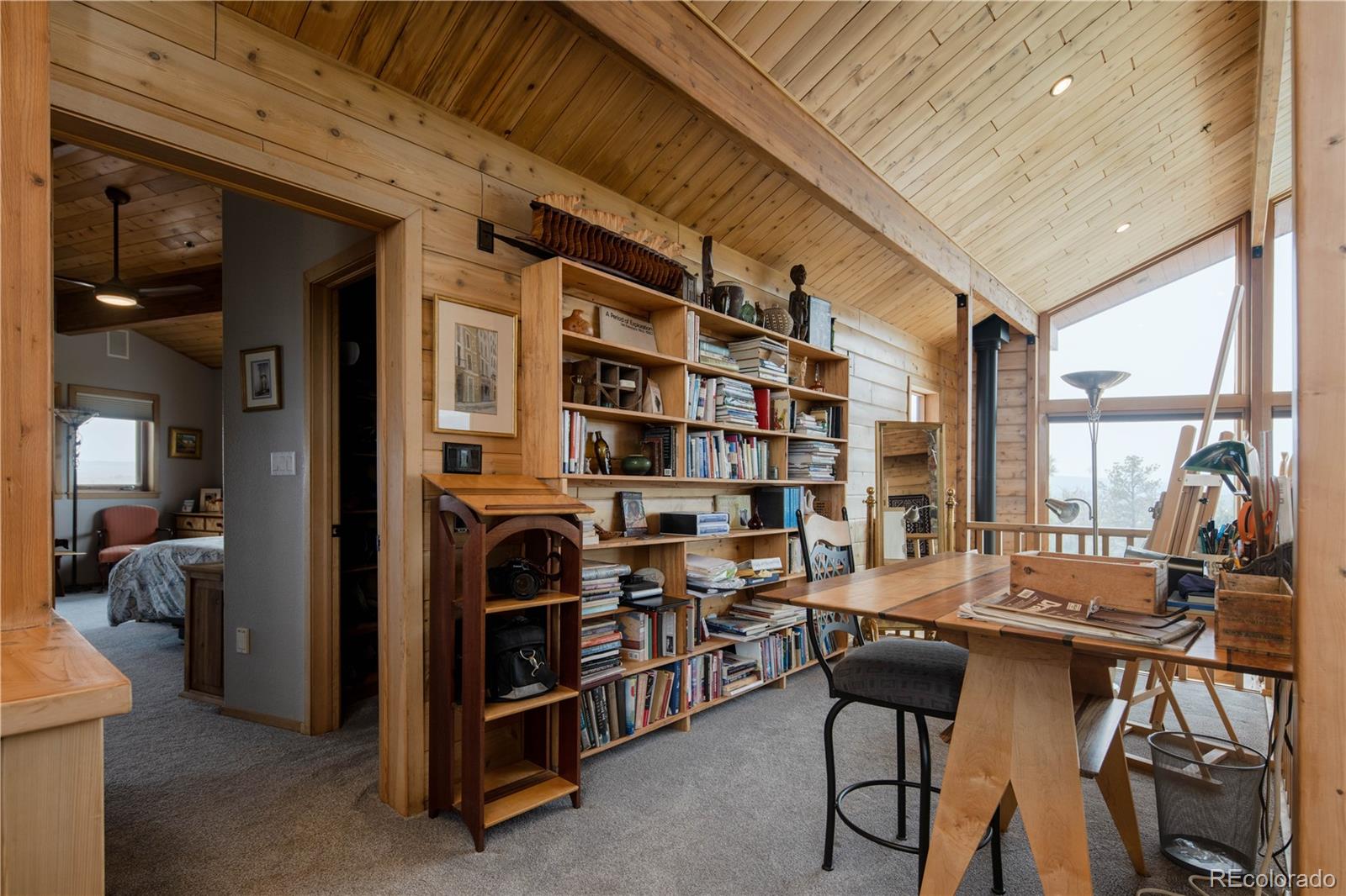 729 Coronado Drive Sedalia, CO 80135 - Photo 17 of 28 a view of a livingroom with furniture and staircase