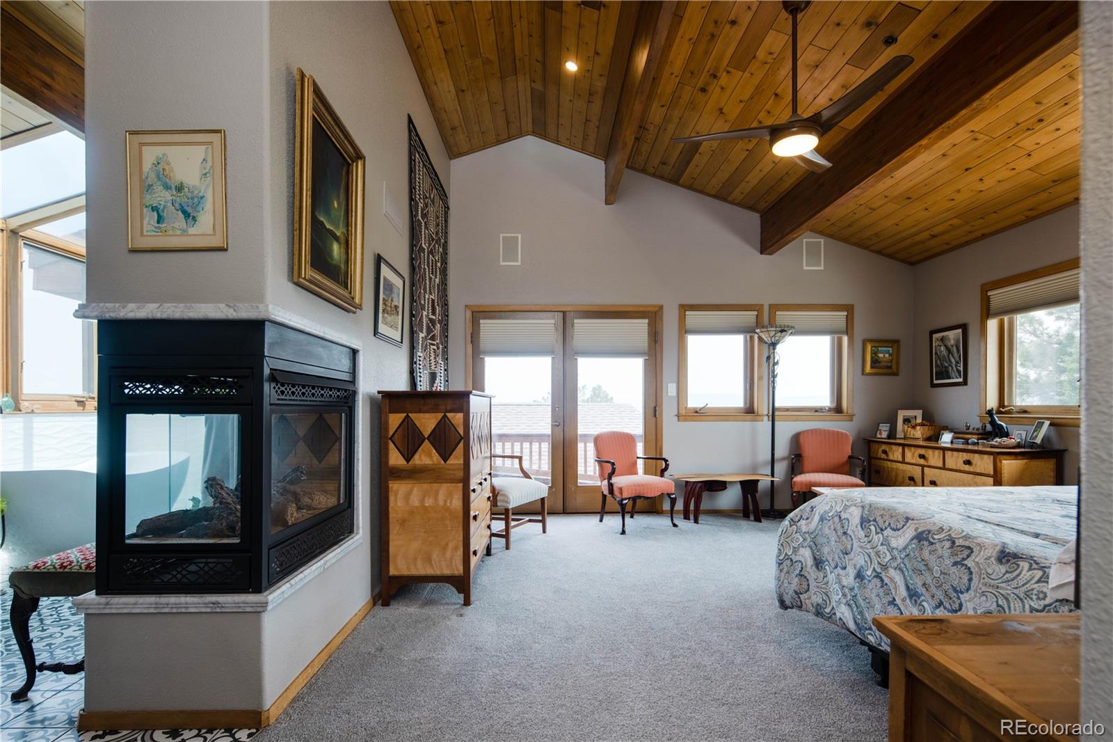 729 Coronado Drive Sedalia, CO 80135 - Photo 18 of 28 a living room with furniture and large windows
