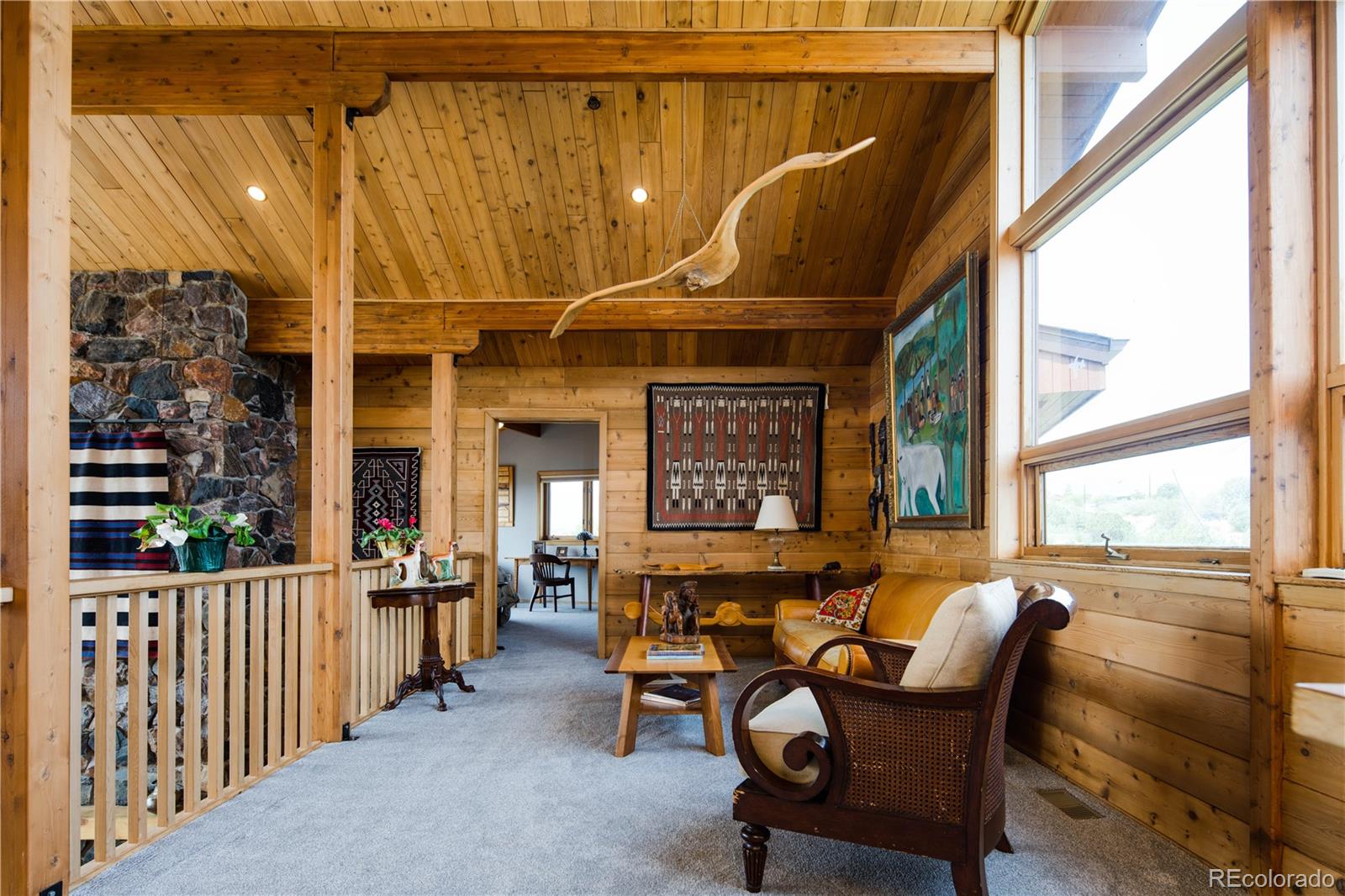 729 Coronado Drive Sedalia, CO 80135 - Photo 21 of 28 a living room with furniture and windows