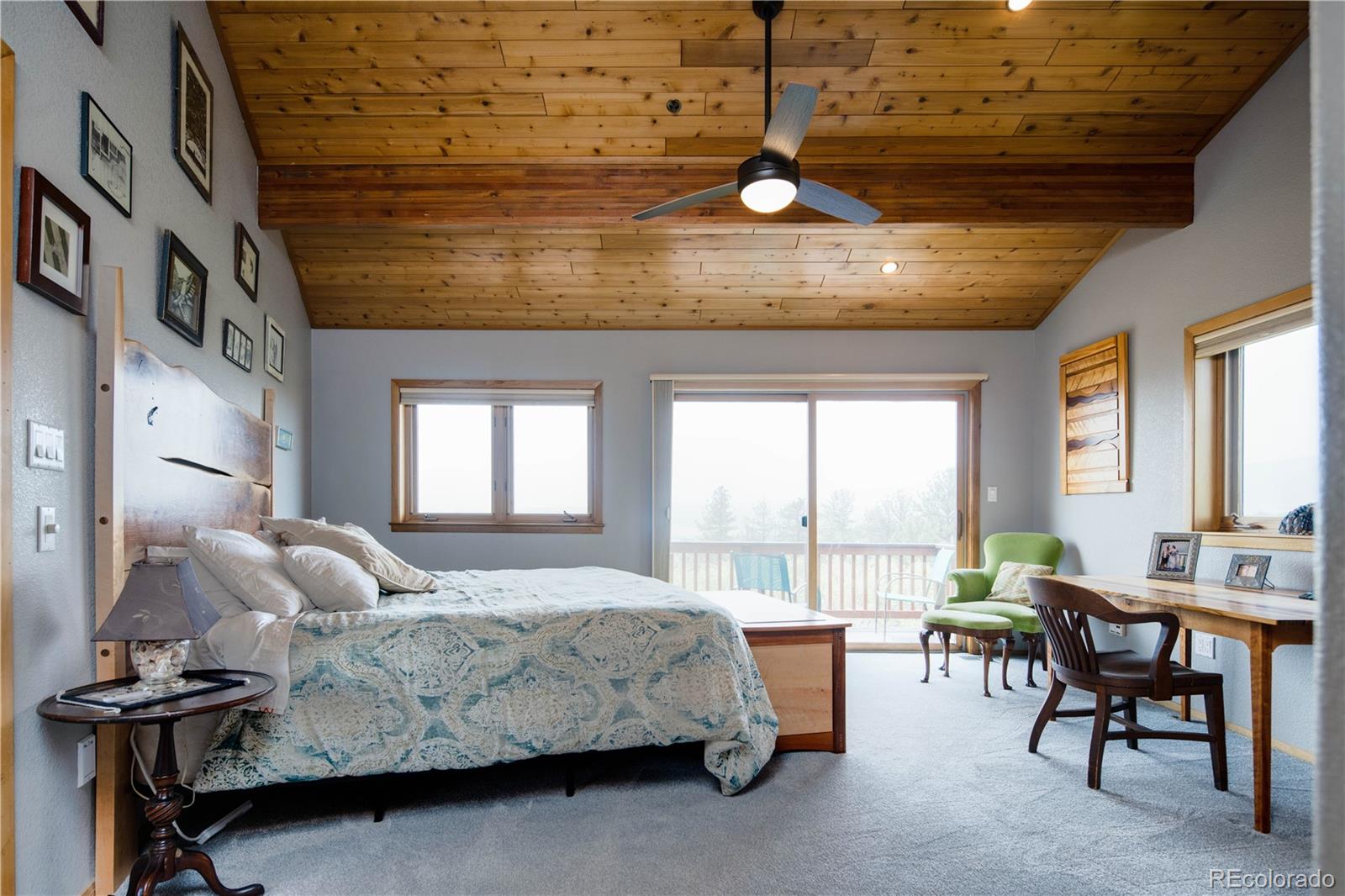 729 Coronado Drive Sedalia, CO 80135 - Photo 22 of 28 a bedroom with furniture and a large window