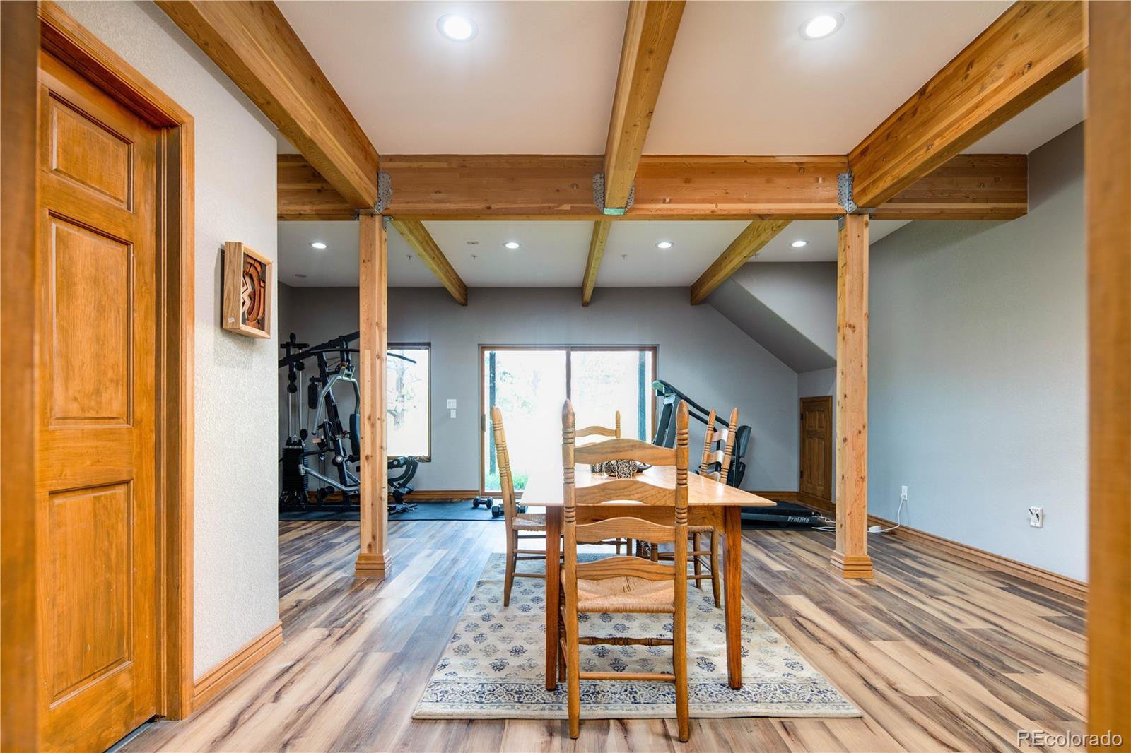 729 Coronado Drive Sedalia, CO 80135 - Photo 24 of 28 a dining room with furniture and wooden floor
