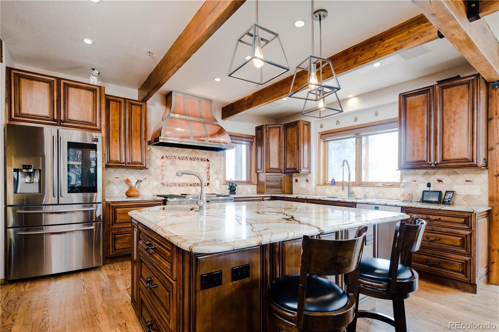729 Coronado Drive Sedalia, CO 80135 - Photo 5 of 28 a kitchen with granite countertop a sink appliances and cabinets