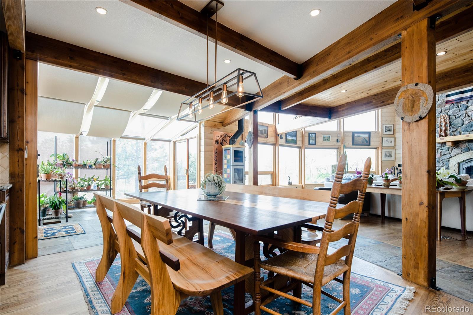 729 Coronado Drive Sedalia, CO 80135 - Photo 7 of 28 a view of a dining room with furniture window and wooden floor