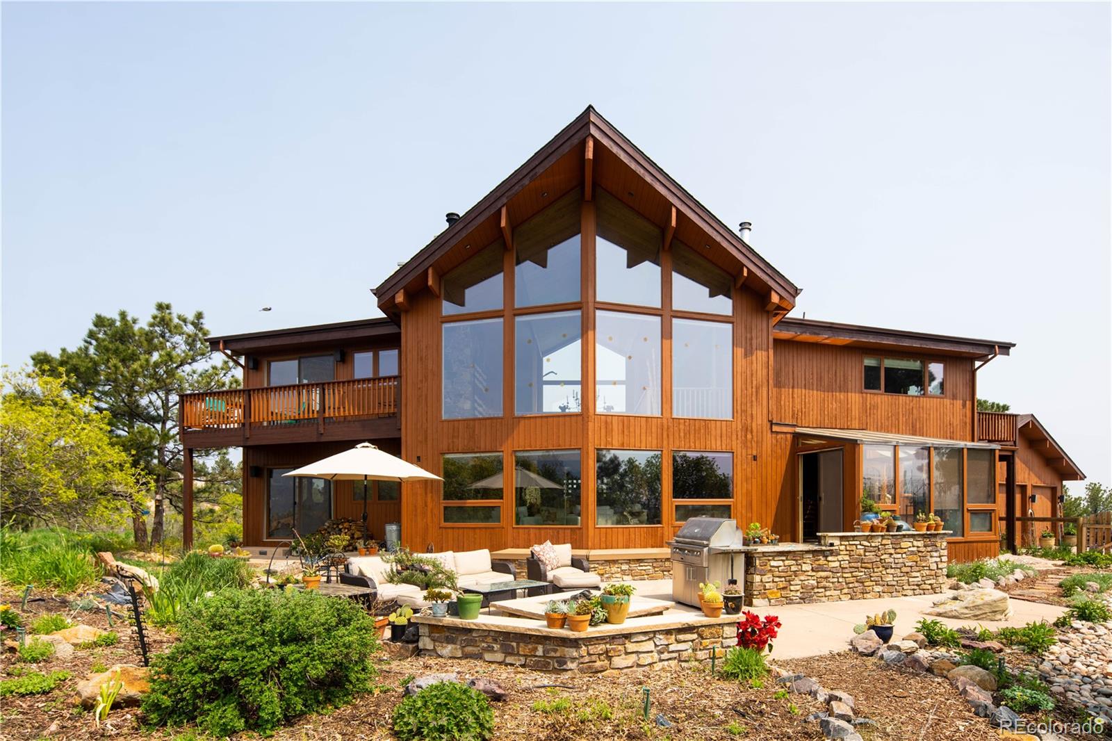 729 Coronado Drive Sedalia, CO 80135 - Photo 10 of 28 a front view of a house with garden