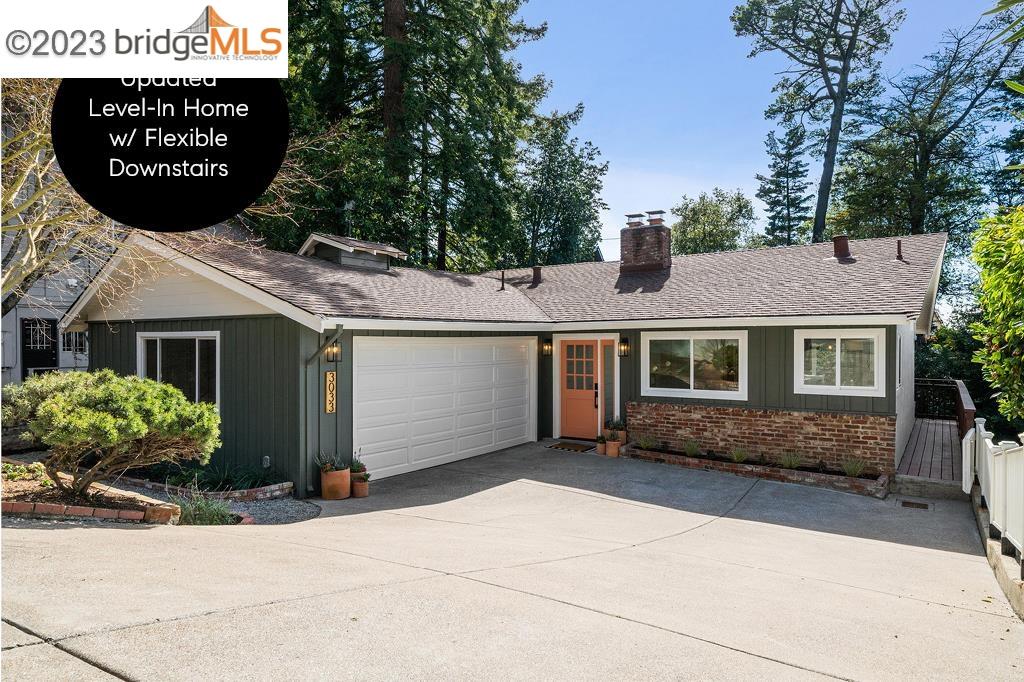 3033 Holyrood Drive Oakland, CA 94611 - Photo 1 of 1 a front view of a house with a garden