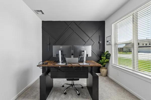 a view of a workspace with furniture