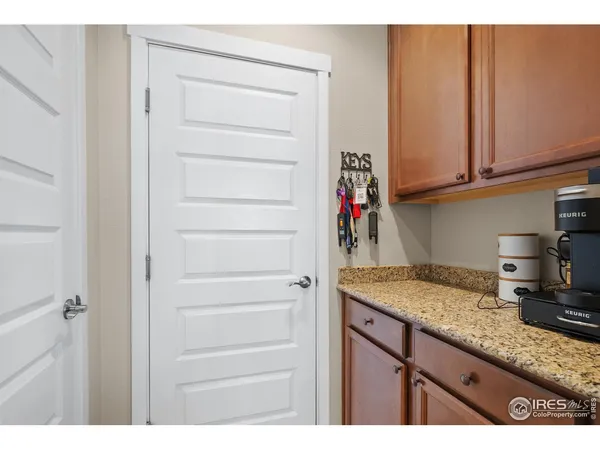a kitchen with cabinets appliances and a counter space