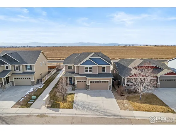 an aerial view of a house with a ocean view