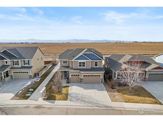 an aerial view of a house with a ocean view