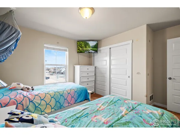 a bedroom with a bed and a cabinets