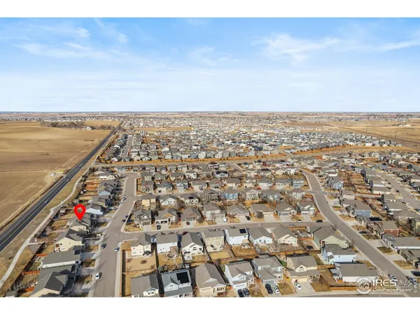 an aerial view of residential building and ocean view