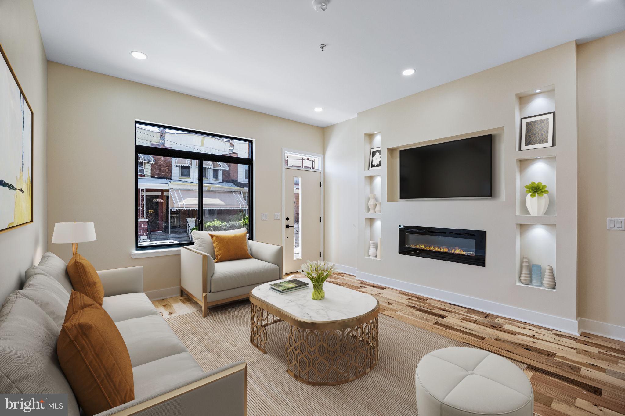 a living room with furniture a fireplace and a flat screen tv