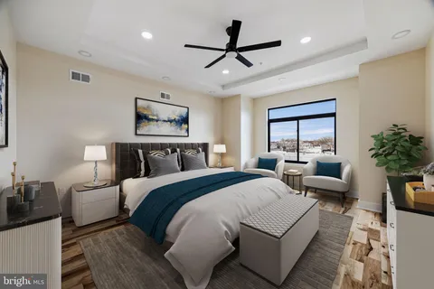 a view of a ceiling fan and wooden floor
