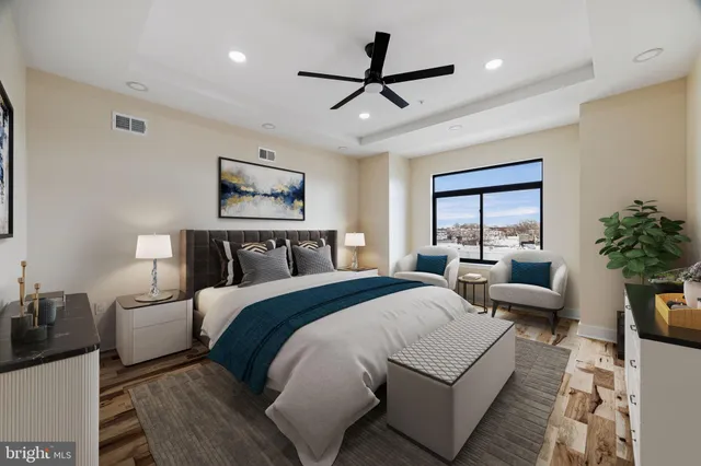 a view of a ceiling fan and wooden floor