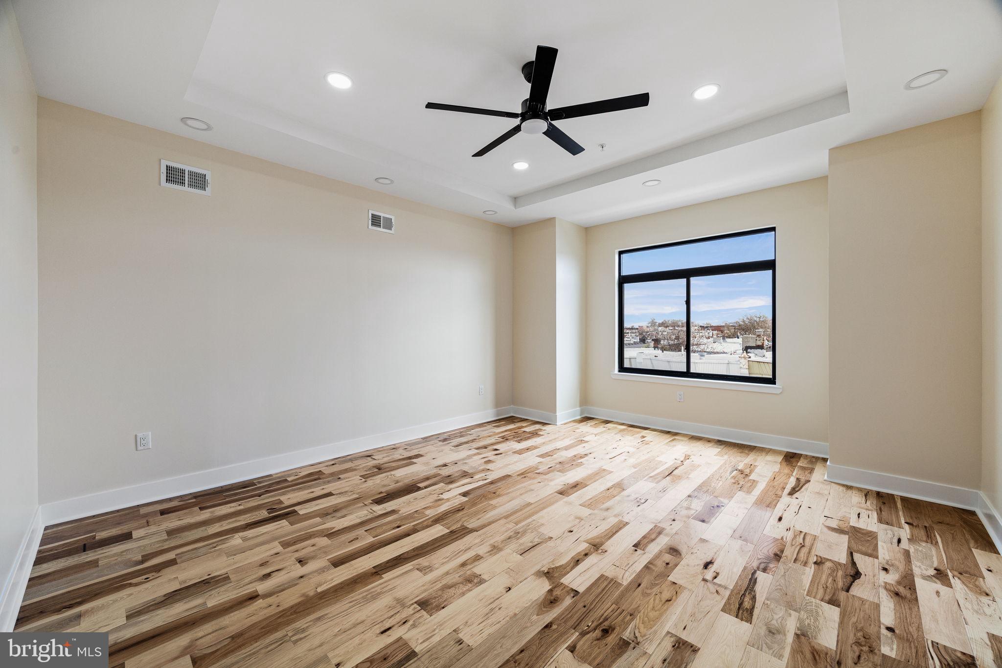 272 South Frazier Street Philadelphia, PA 19139 - Photo 21 of 34 a bedroom with a bed and a window