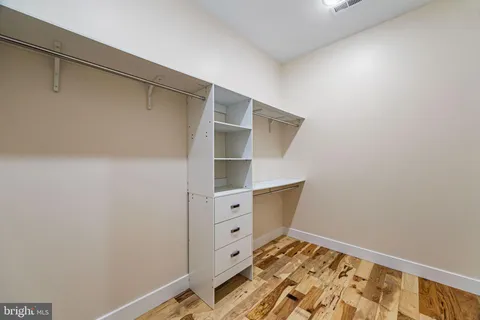 a bathroom with a granite countertop toilet sink and shower
