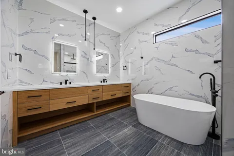 a bathroom with a toilet bathtub and shower