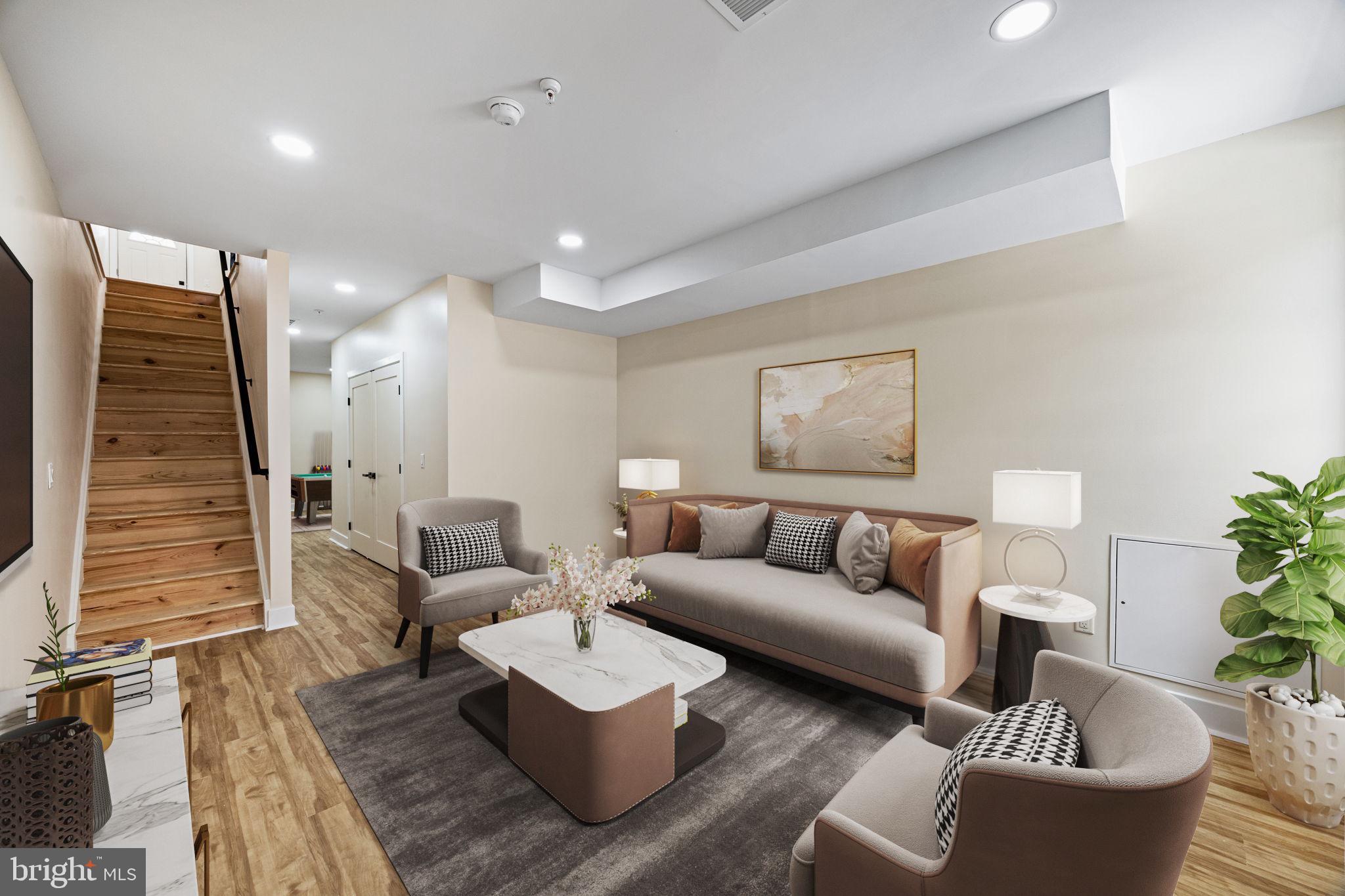 272 South Frazier Street Philadelphia, PA 19139 - Photo 27 of 34 a living room with furniture and a flat screen tv