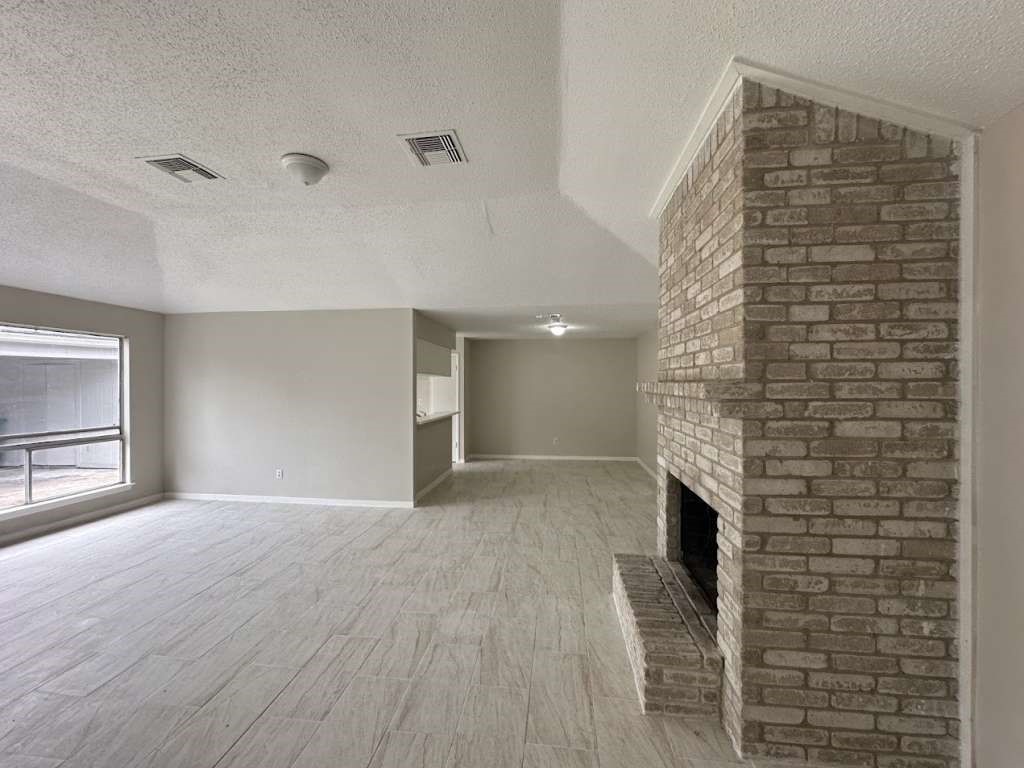 11807 South Youngwood Lane Houston, TX 77043 - Photo 5 of 13 a view of empty room with wooden floor