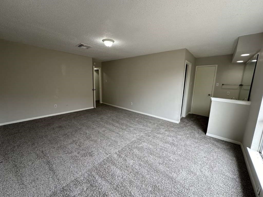 11807 South Youngwood Lane Houston, TX 77043 - Photo 8 of 13 a view of an empty room with a window