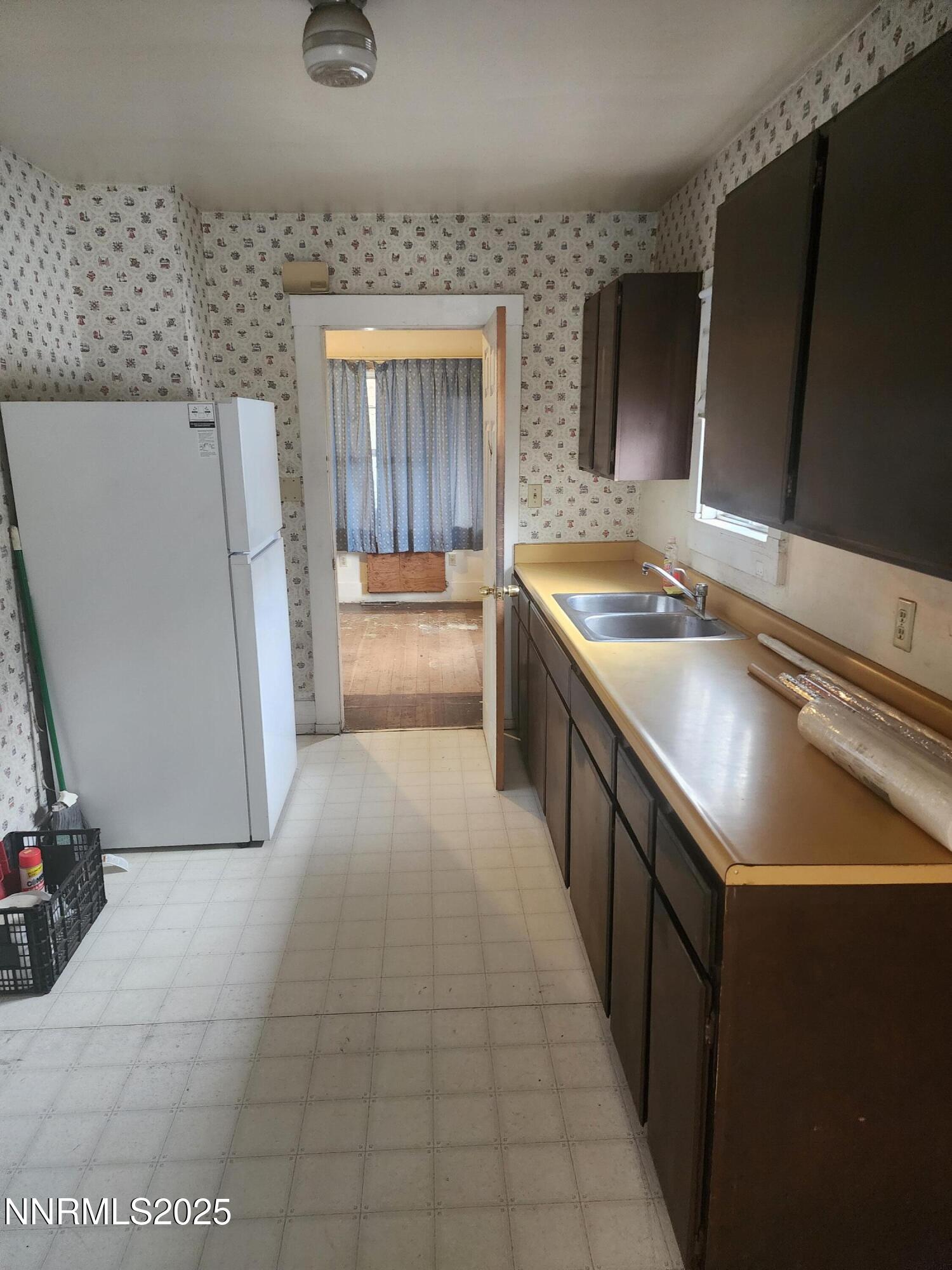 460 East 8th Street Reno, NV 89512 - Photo 6 of 6 a kitchen with a sink stove and refrigerator
