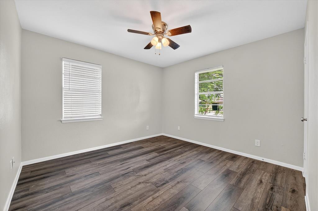 205 Wayne Street Sanger, TX 76266 - Photo 15 of 29 wooden floor in an empty room with a window