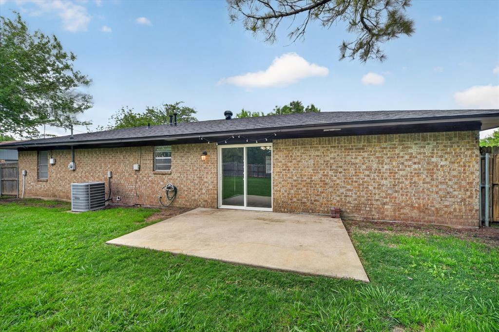 205 Wayne Street Sanger, TX 76266 - Photo 26 of 29 a front view of a house with garden