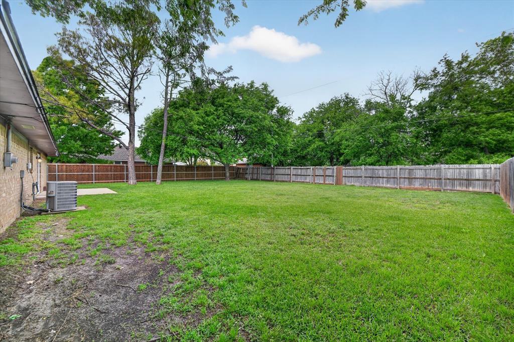 205 Wayne Street Sanger, TX 76266 - Photo 27 of 29 a view of yard with grass and trees
