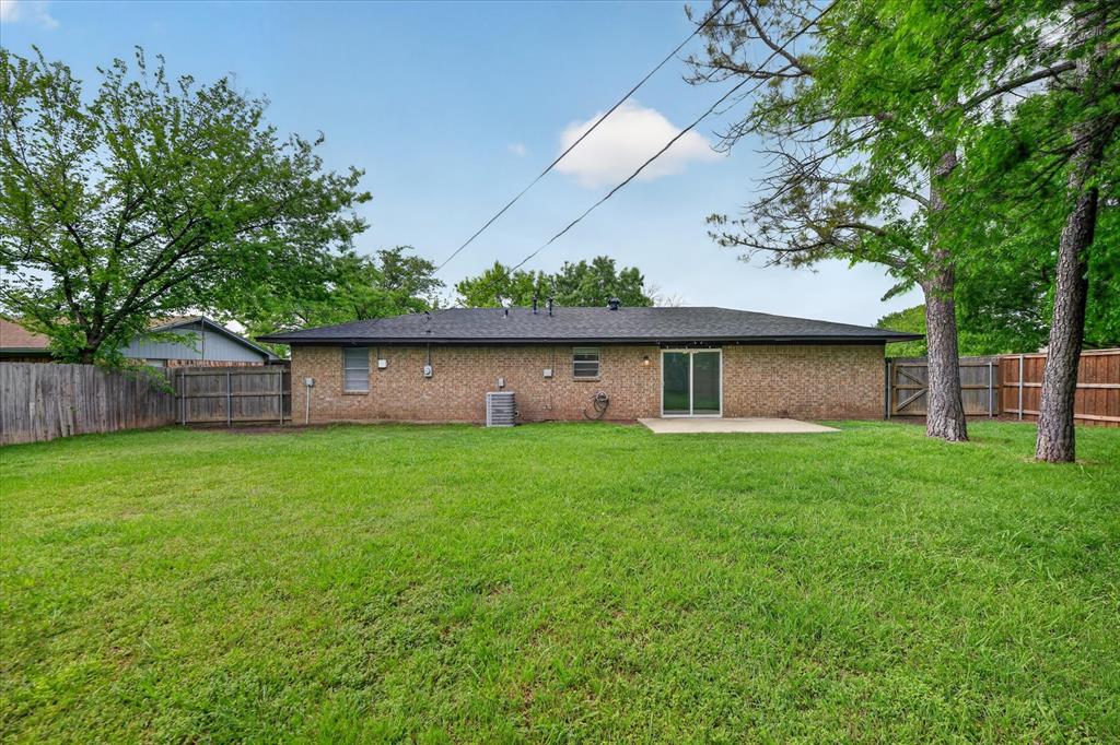 205 Wayne Street Sanger, TX 76266 - Photo 29 of 29 a view of a house with a back yard