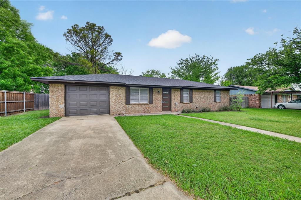 205 Wayne Street Sanger, TX 76266 - Photo 5 of 29 a front view of house with a garden