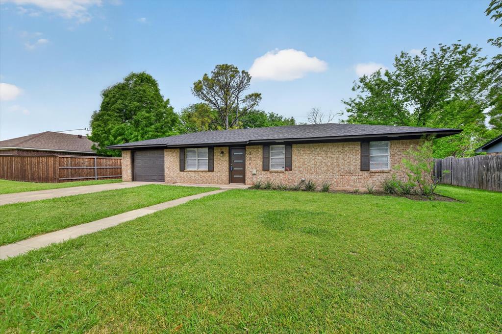 205 Wayne Street Sanger, TX 76266 - Photo 6 of 29 a front view of house with a garden