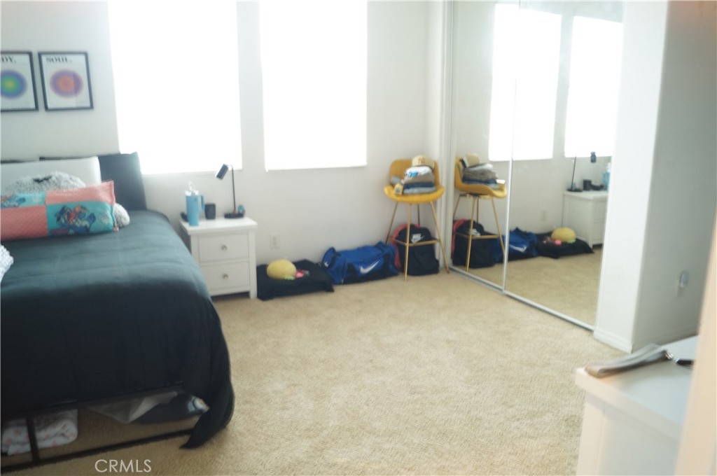 9503 Orleans Lane Riverside, CA 92508 - Photo 21 of 28 a bed room with a bed and a chair