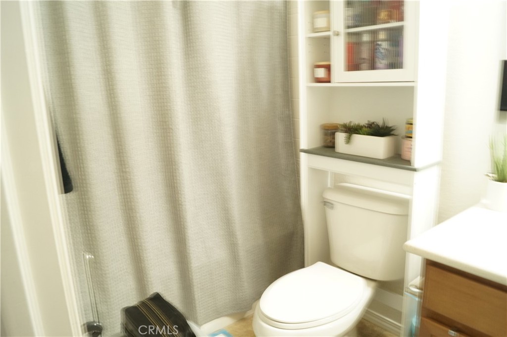 9503 Orleans Lane Riverside, CA 92508 - Photo 22 of 28 a white toilet sitting next to a bathroom sink