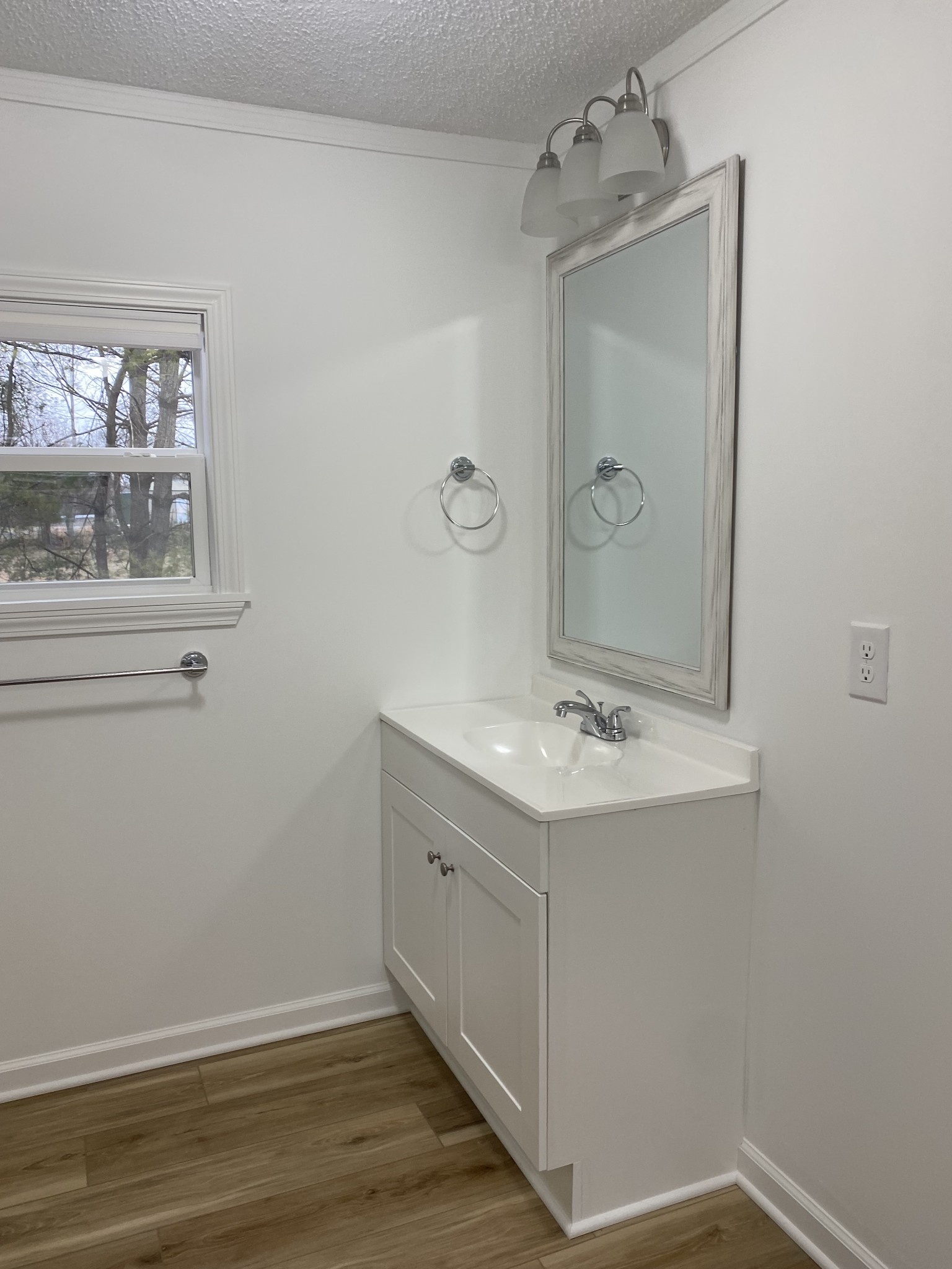 404 B Dorris Road, Unit B Portland, TN 37148 - Photo 14 of 24 a bathroom with a sink a mirror and a vanity