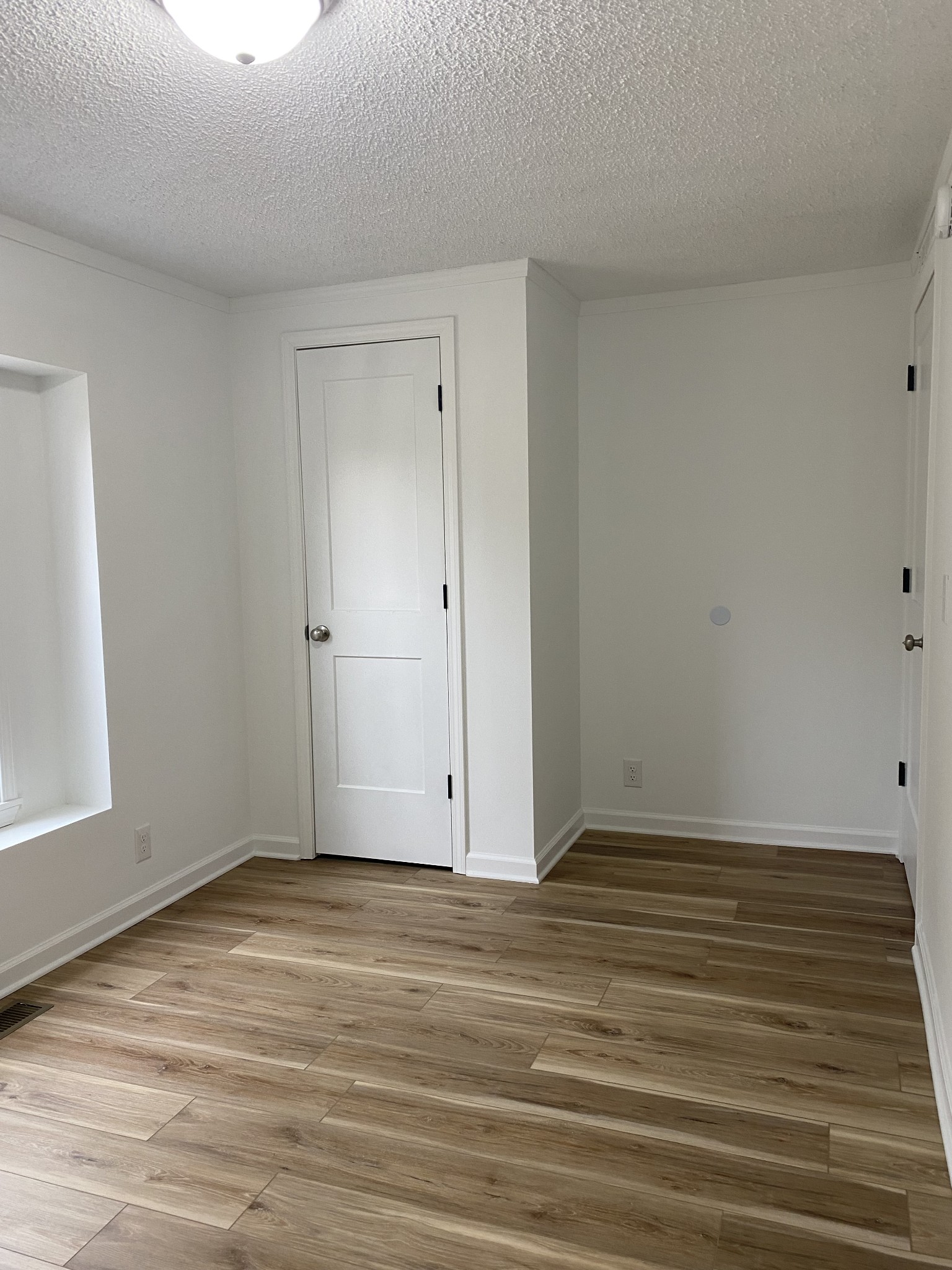 404 B Dorris Road, Unit B Portland, TN 37148 - Photo 16 of 24 a view of an empty room with wooden floor