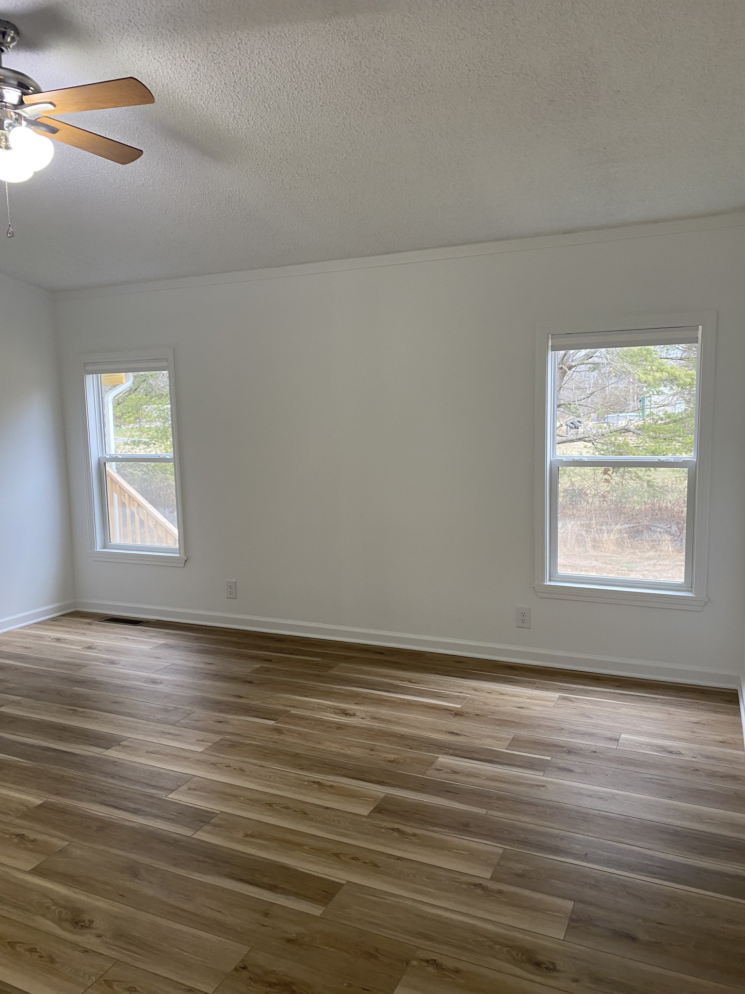 404 B Dorris Road, Unit B Portland, TN 37148 - Photo 2 of 24 an empty room with wooden floor and windows