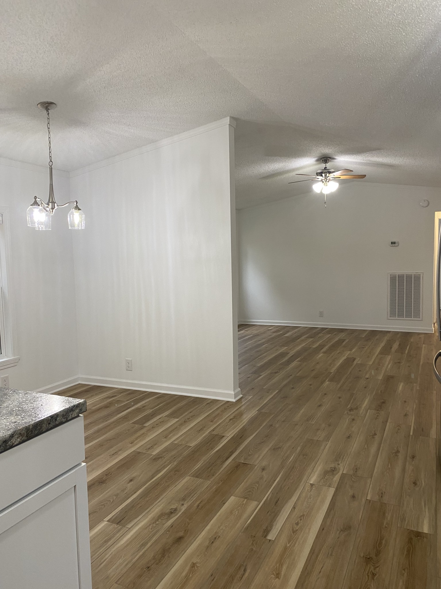 404 B Dorris Road, Unit B Portland, TN 37148 - Photo 8 of 24 an empty room with wooden floor fan and window