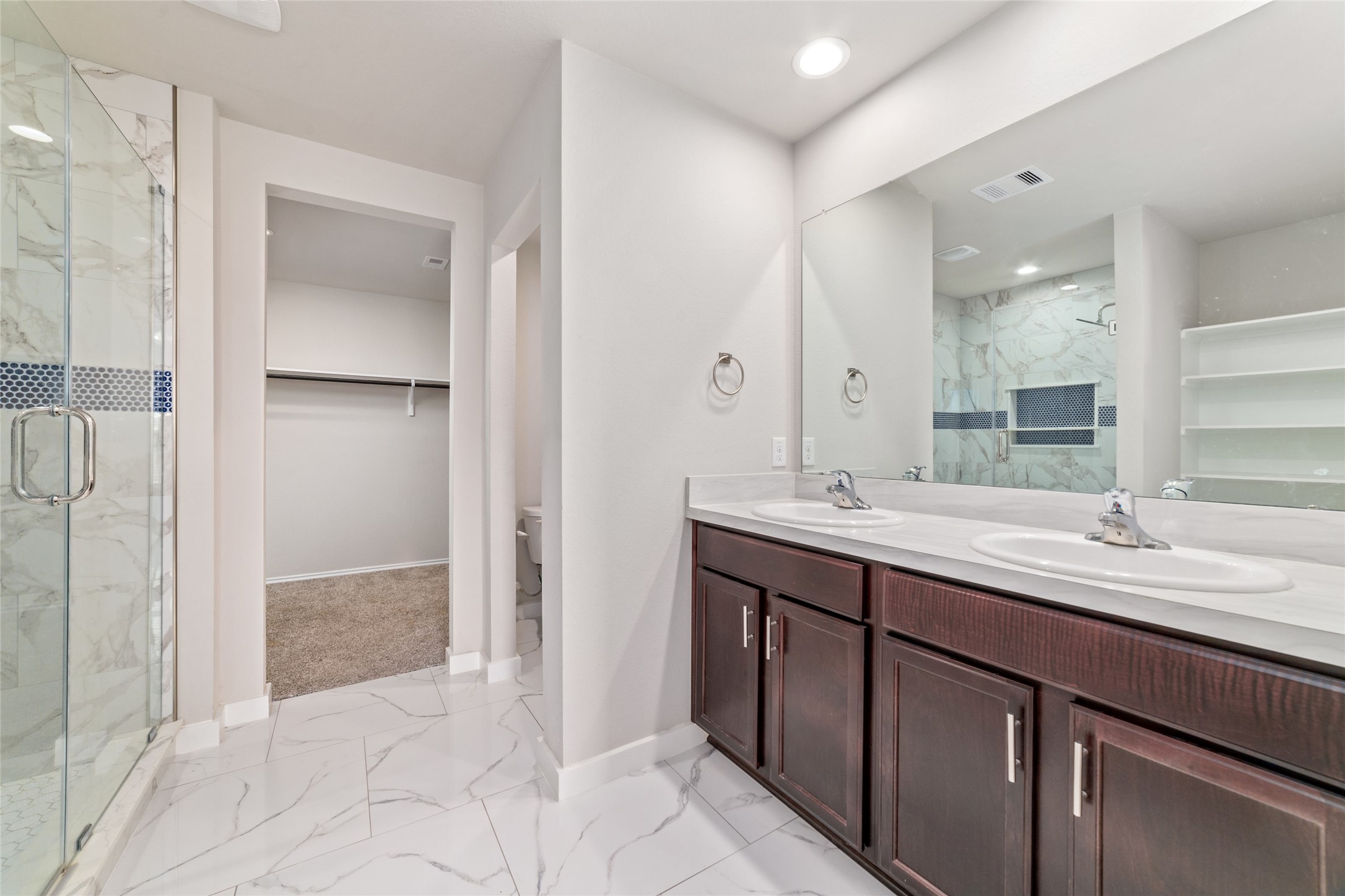 5502 Creekside Ridge Trail Katy, TX 77449 - Photo 20 of 25 a bathroom with a double vanity sink and mirror