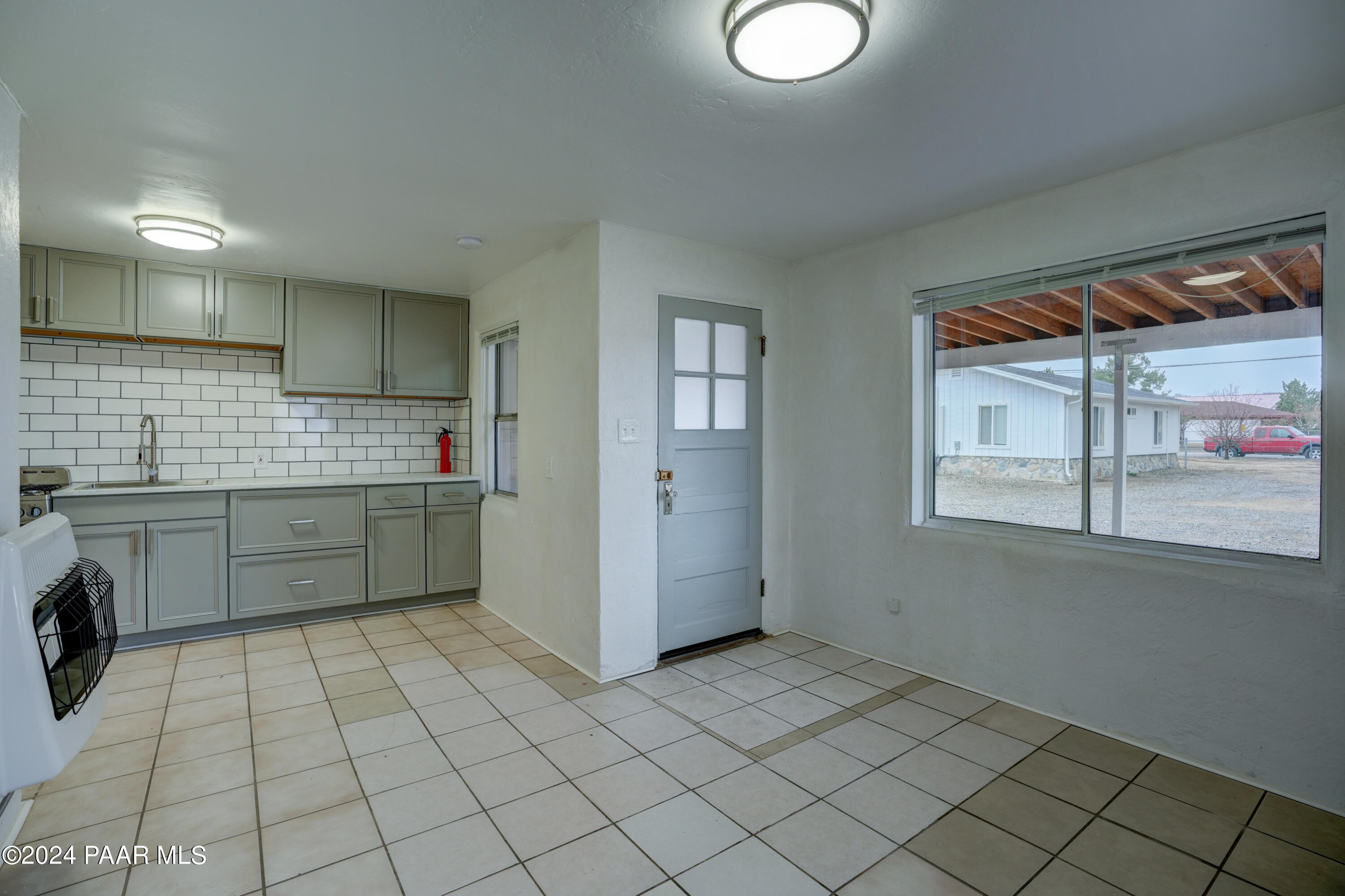 925 Ruth Street, Unit B Prescott, AZ 86301 - Photo 3 of 15 a kitchen with a sink cabinets and window