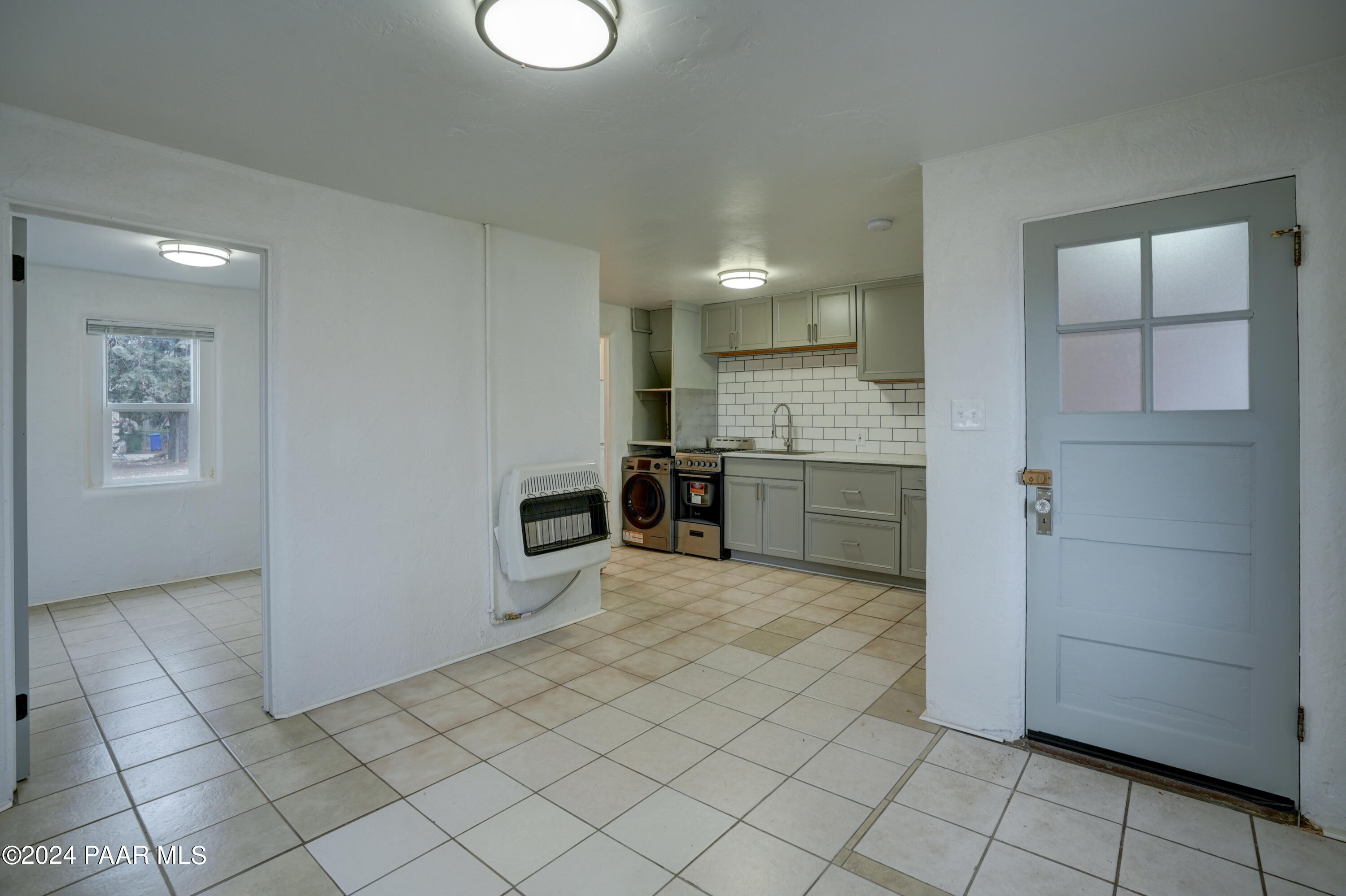 925 Ruth Street, Unit B Prescott, AZ 86301 - Photo 4 of 15 a view of a kitchen with microwave and cabinets