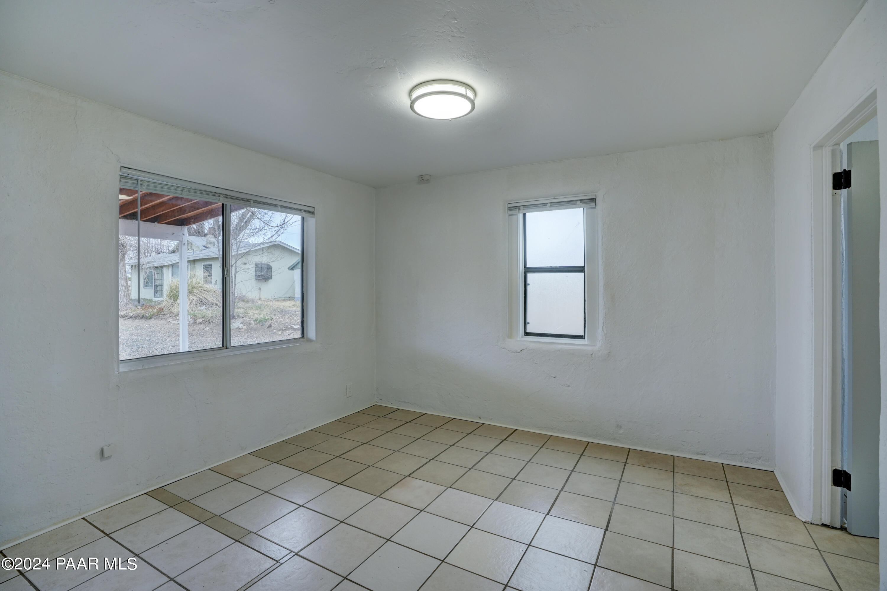 925 Ruth Street, Unit B Prescott, AZ 86301 - Photo 6 of 15 an empty room with windows